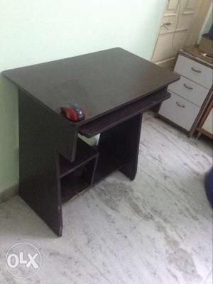 Computer table in blackish brown colour