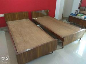 Two wooden single beds. Can be used jointly as a king size