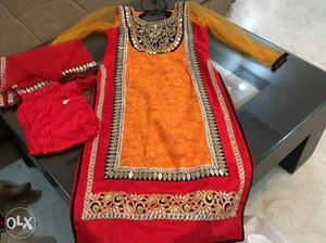 A beautiful orange and red suit... brand new