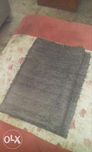 Black woollen carpet