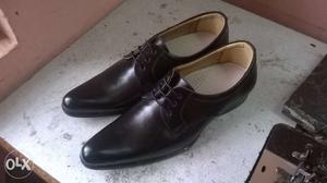 Brand new black leather shoes, size  available.