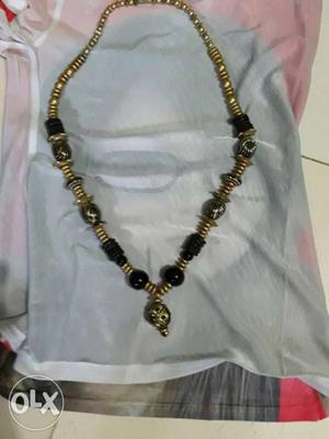 Gold-colored And Black Beaded Necklace With Pendant