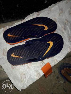 Men's Pair Of Black-and-orange Nike Flipflops