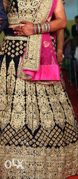 Navy blue bridal lehenga with pink dupatta from