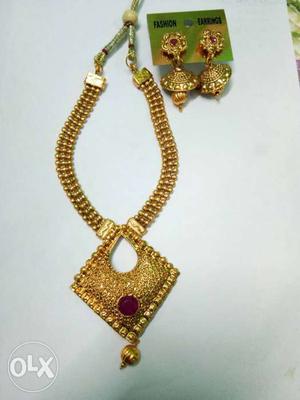 Pair Of Gold Earrings And Gold Necklace