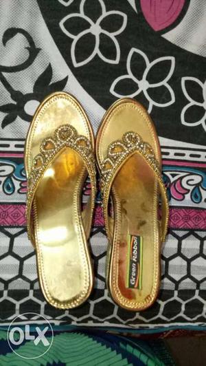 Pair Of Women's Gold Sandals