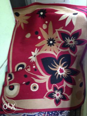 Red, Black And Beige Floral Textile