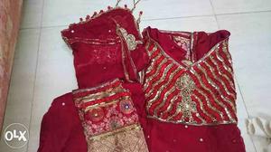 Red heavy ribbon & brocade churidar suit & pure