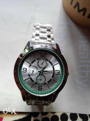 Round Silver And Green Timex Chronograph Watch With Linked