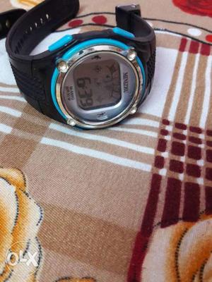 Silver And Blue Digital Watch With Black Strap