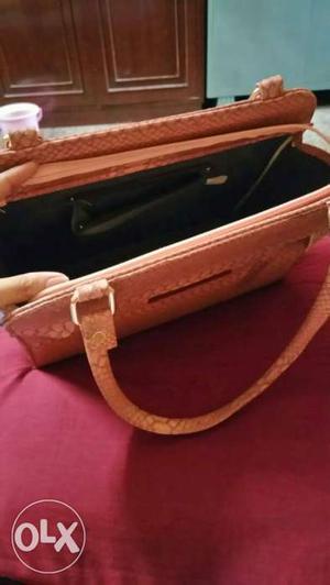 Trendy peach colour purse for the stylish