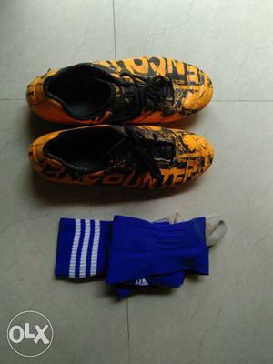 Yellow-and-black Athletic Shoes And Blue-and-white Socks