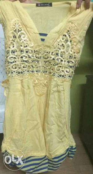 Yellow sleeveless top with good cloth material.