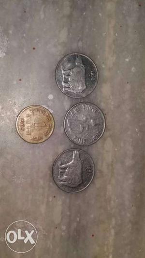 25 paise coins with rhino symbol and a one paise