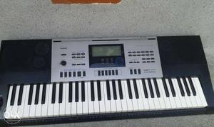 Gray And Black Casio Electronic Keyboard
