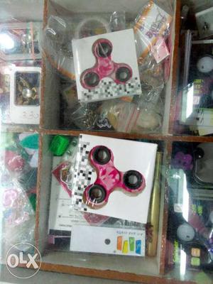Two Pink-and-beige Camouflage Fidget Hand Spinners In