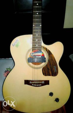 Beige Gibson Cutaway Acoustic Guitar