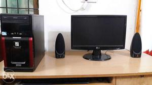 Black Computer Flat Screen Monitor With Black Speakers,