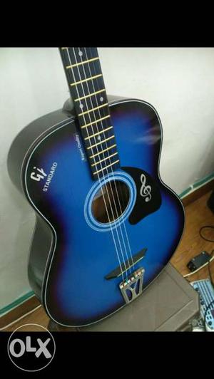 Blue and black acoustic guitar, very amazing