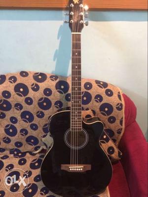 Brand new black guitar with cover and other free things.