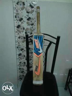 Brown, Blue, Orange And White Nike Cricket Bat