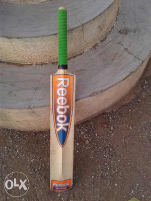 Brown, Orange, Blue And Green Reebok Cricket Bat