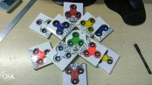Green, Yellow, White, Red, And Blue Fidget Hand Spinner
