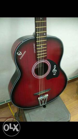 Red and black Acoustic guitar, This guitar is