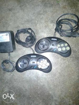 Two Black Sega Genesis Controllers