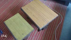 Two Brown And Green Wooden Tables