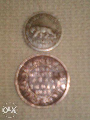 Two Round Brown And Silver Coins