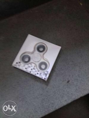 White And Black Fidget Spinner On Box