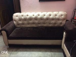 Black Velvet Sofa With Tufted Beige Padded Backrest
