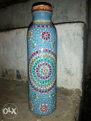 Copar bottla Green, Yellow, And Blue Floral Bottle copar