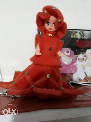 Doll In Red Sleeveless Gown