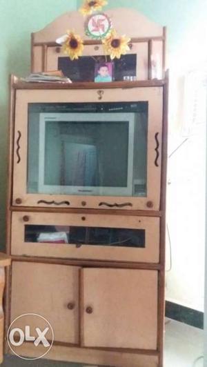 Gray CRT Television; Beige And Brown Wooden TV Hutch Cabinet