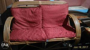 Rattan Loveseat With Red Cushion