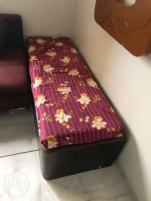 Side bed with storage below and small mattress on