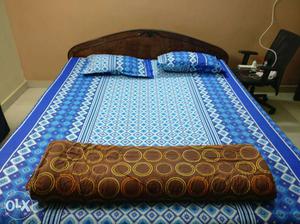 Teakwood king size bed to be sold with mattress.