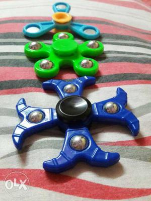 Three Blue, Green, And Teal Fidget Spinners