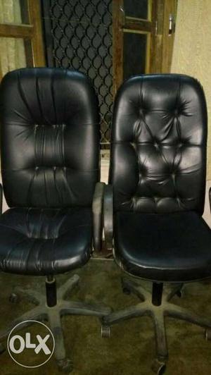 Two Black Leather Tufted Back Rolling Chairs