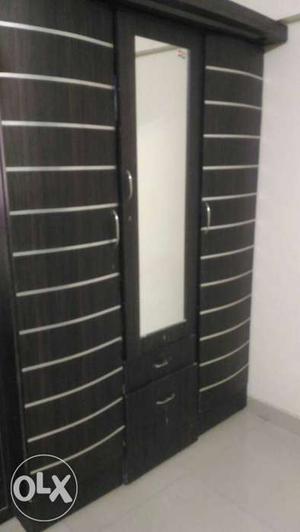 Wooden wardrobe with 3 large drawers and 4 small