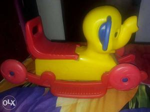 Yellow And Red Plastic Rocking Ride On Toy