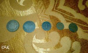 A collection of 5 old coins belonging to the