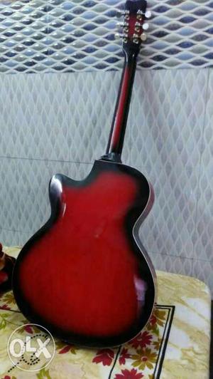 Black And Red Cutaway Acoustic Guitar