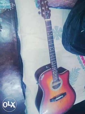 Its 6month old Brown acoustic guitar No problem