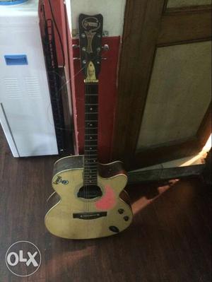 Beige And Brown Acoustic Guitar