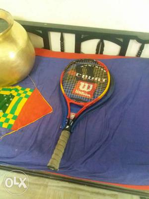 Brown, Black, And Red Wilson Tennis Racket