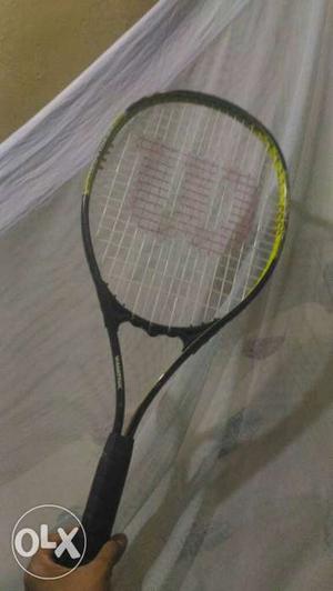Green And Black Wilson Tennis Racket