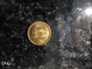 Round Gold Indian Paise